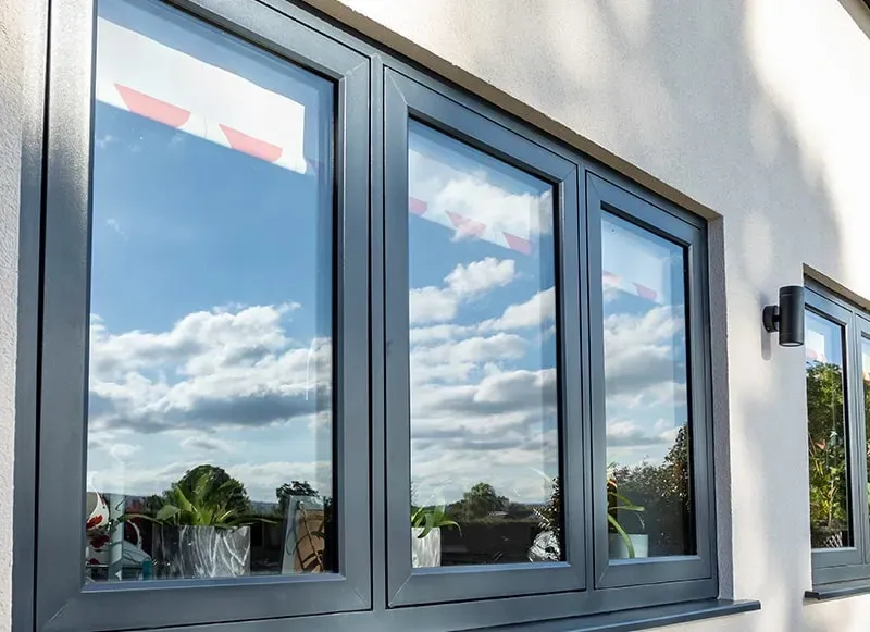 Sistem jendela UPVC tilt and turn warna hitam dengan posisi membuka miring ke atas